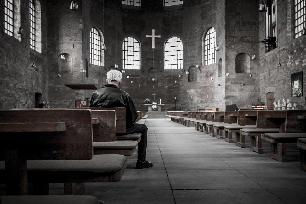 Man Sitting in Church